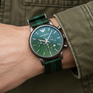 Extreme wrist macro of Armani AR1950 showing woven green strap texture