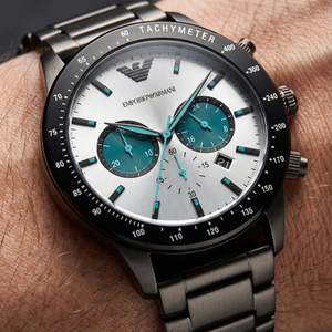 Close up of Armani AR11471 showing vibrant teal turquoise sub-dials and black bezel