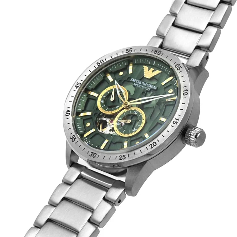 Detailed shot of the gold-tone hands and eagle logo on the dark green AR60053 dial