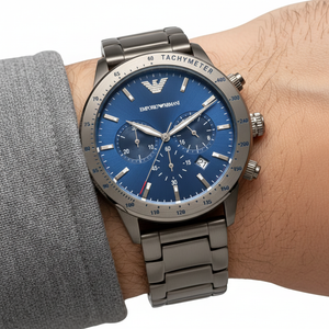 Extreme wrist macro of Armani AR80045 showing blue sunray dial and gunmetal finish