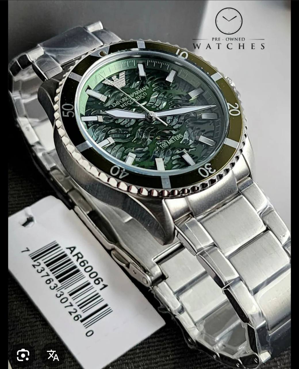 Detailed view of the luminous hands and indices on the Emporio Armani AR60061 dial