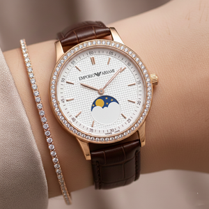 Close up of Armani AR11568 showing the colorful moon and stars indicator on white dial