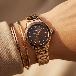Extreme wrist macro of Armani AR11570 showing chocolate dial and crystal markers