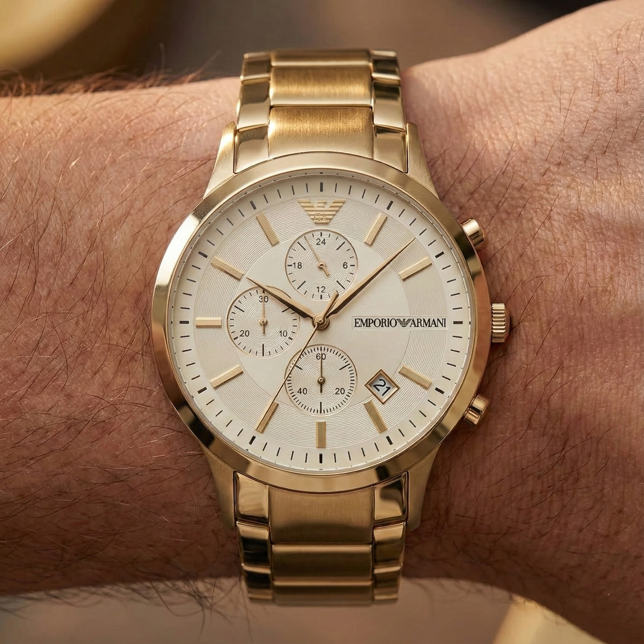 Close up of Armani AR11332 showing off-white dial and gold baton indices