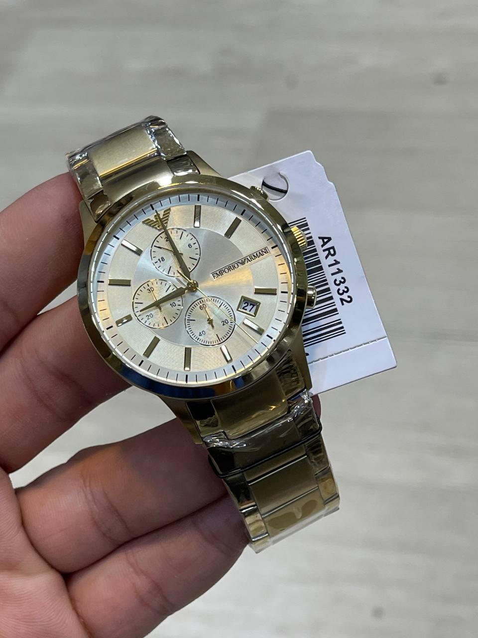 Emporio Armani Renato AR11332 on wrist showing bold gold luxury style