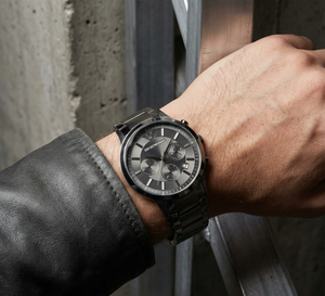 Man wearing Emporio Armani AR2453 all black watch with black suit