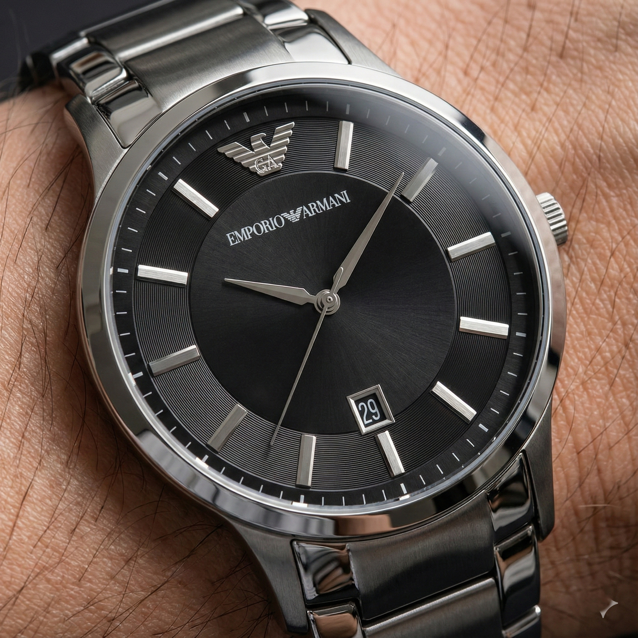 Close up of Armani AR2457 showing black dial with silver indices and date window