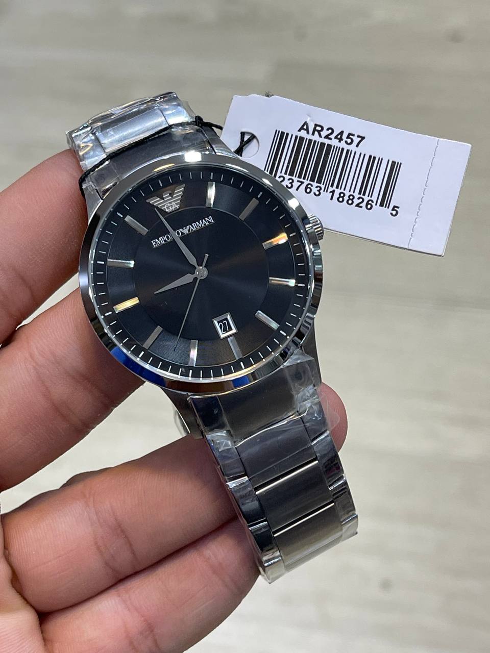 Emporio Armani Renato AR2457 on wrist showing elegant black and silver contrast