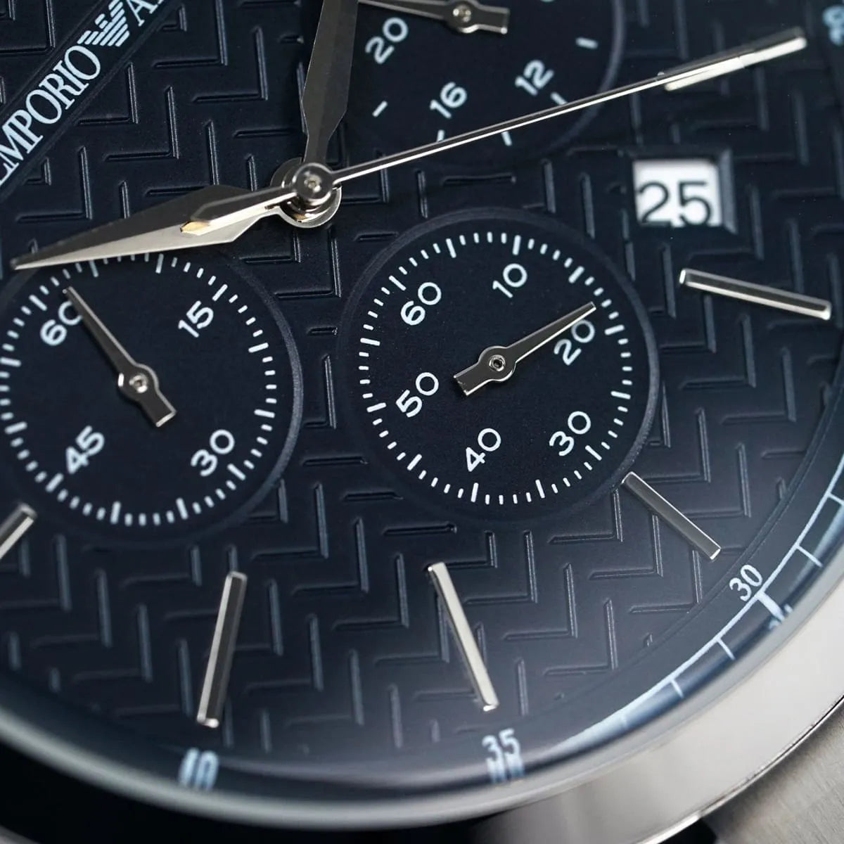Close-up shot of Emporio Armani AR2486 blue dial showing chevron texture