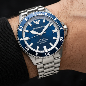 Macro shot of the Armani AR60079 blue dial showing automatic 200m text and silver markers