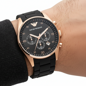 Extreme wrist macro of Armani AR5905 showing silicone-wrapped links and rose gold case