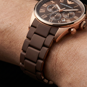Close up of Armani AR5890 showing brown silicone wrapped links and rose gold details