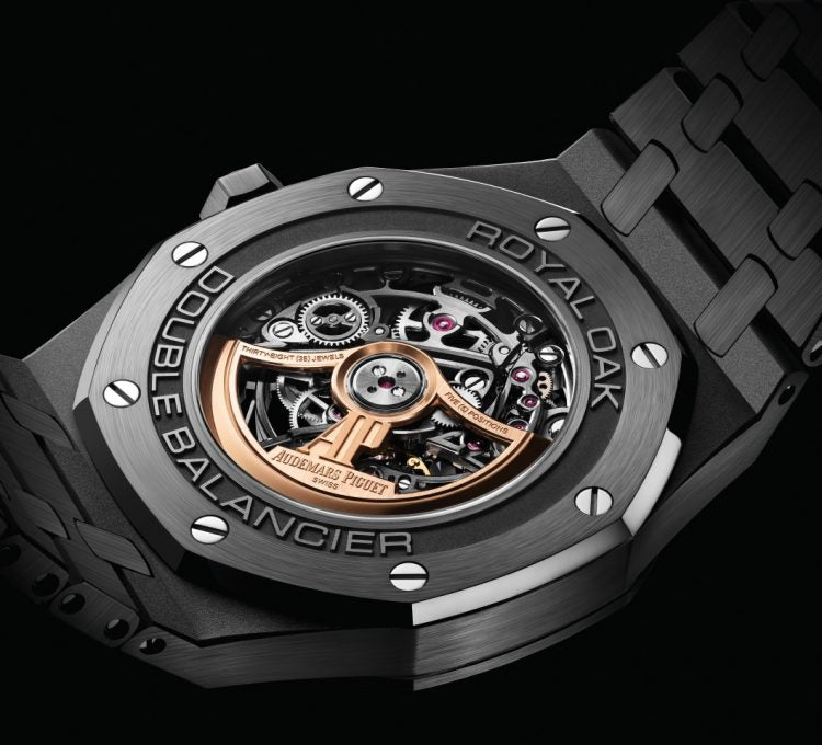 Audemars Piguet Royal Oak 15416CE.OO.1225CE.01 men's automatic watch, openworked dial, black ceramic bracelet – caseback view on dark background