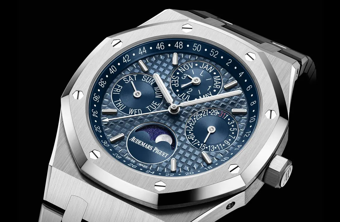 Audemars Piguet Royal Oak 26574ST.OO.1220ST.03 men's perpetual calendar watch, blue dial, silver stainless steel bracelet – angle view on dark background