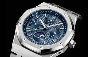 Audemars Piguet Royal Oak 26574ST.OO.1220ST.03 men's perpetual calendar watch, blue dial, silver stainless steel bracelet – angle view on dark background