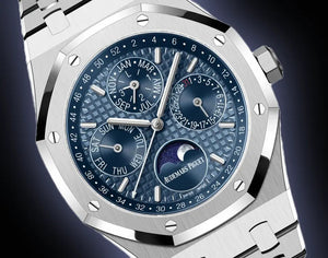 Audemars Piguet Royal Oak 26574ST.OO.1220ST.03 men's perpetual calendar watch, blue dial, silver stainless steel bracelet – front close-up on dark background
