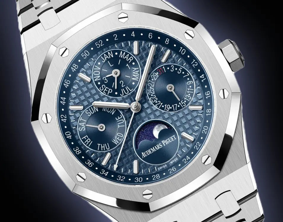 Audemars Piguet Royal Oak 26574ST.OO.1220ST.03 men's perpetual calendar watch, blue dial, silver stainless steel bracelet – front close-up on dark background
