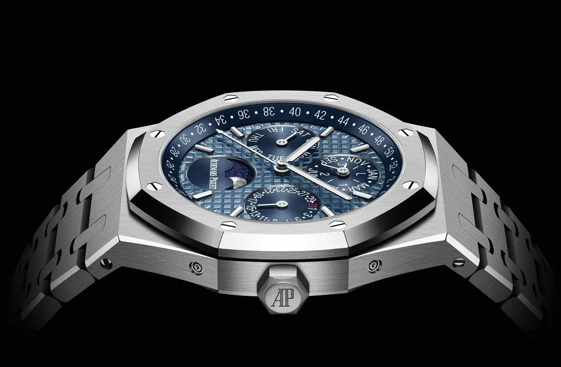 Audemars Piguet Royal Oak 26574ST.OO.1220ST.03 men's perpetual calendar watch, blue dial, silver stainless steel bracelet – side angle view on dark background