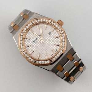 Audemars Piguet Royal Oak 67651SR.ZZ.1261SR.01 women's quartz watch, silver dial, diamond bezel, two-tone stainless steel bracelet – angle view on grey background
