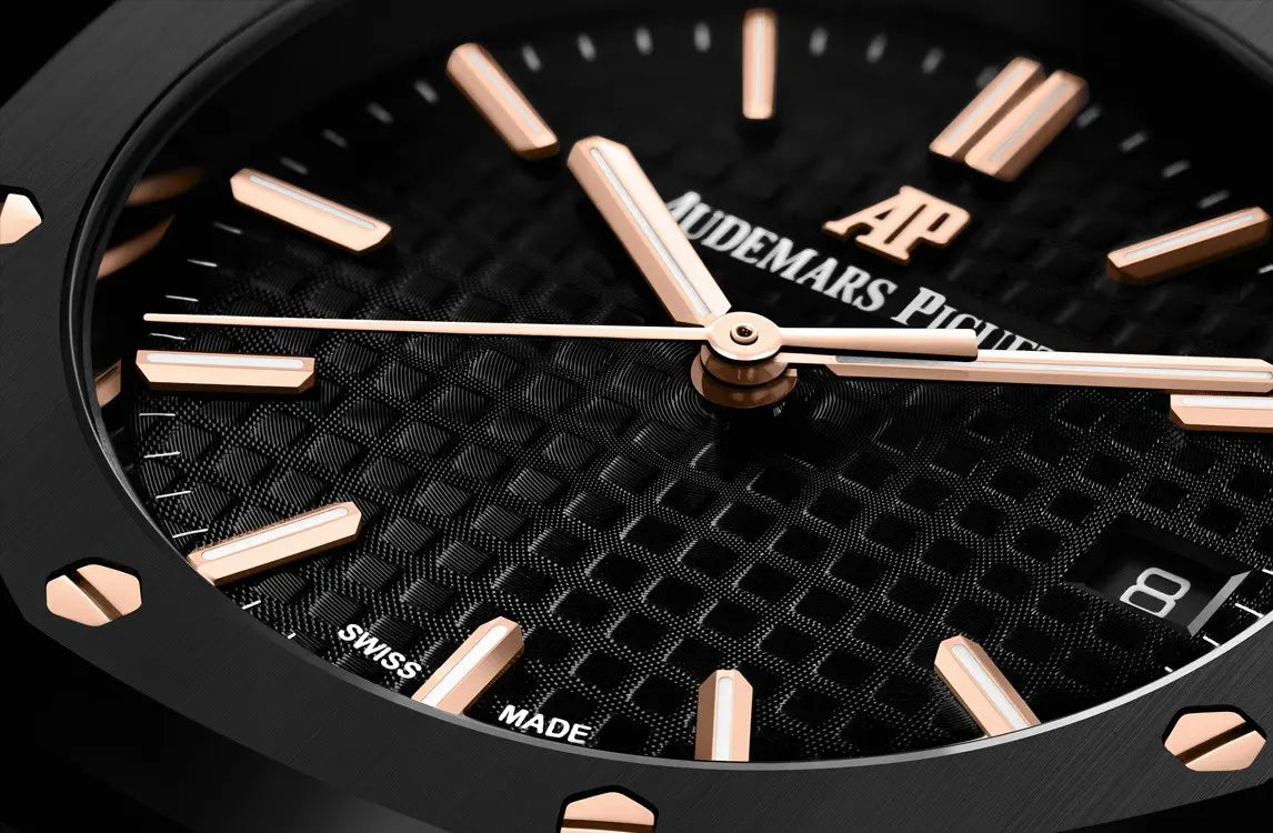 Audemars Piguet Royal Oak men's automatic watch, black dial, black bracelet – angle close-up on dark background