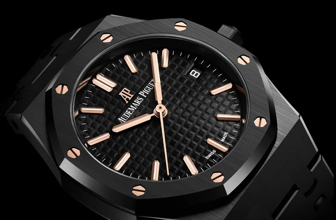 Audemars Piguet Royal Oak men's automatic watch, black dial, black bracelet – front view on dark background