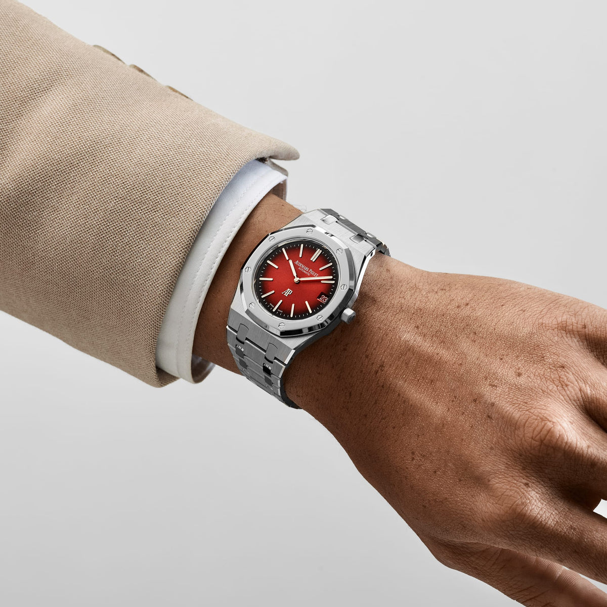 Audemars Piguet Royal Oak men's automatic watch, red gradient dial, silver stainless steel bracelet – on-wrist view