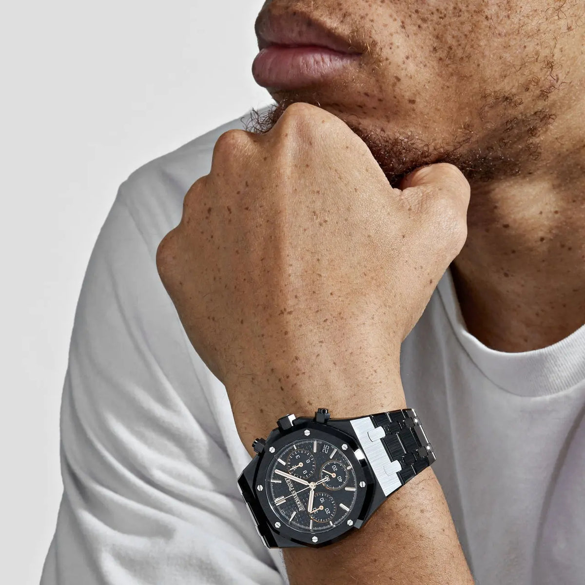 Audemars Piguet Royal Oak men's chronograph watch, black dial, black bracelet – on-wrist lifestyle view