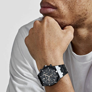 Audemars Piguet Royal Oak men's chronograph watch, black dial, black bracelet – on-wrist lifestyle view