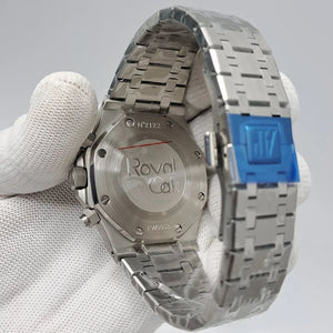 Audemars Piguet Royal Oak men's chronograph watch, green dial, silver stainless steel bracelet – caseback in-hand view