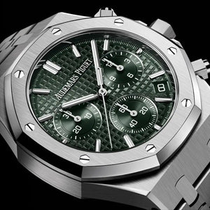 Audemars Piguet Royal Oak men's chronograph watch, green tone-on-tone dial, silver stainless steel bracelet – angle close-up on dark background