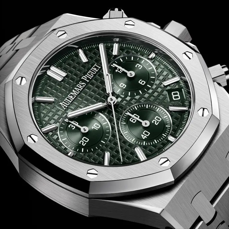 Audemars Piguet Royal Oak men's chronograph watch, green tone-on-tone dial, silver stainless steel bracelet – angle close-up on dark background