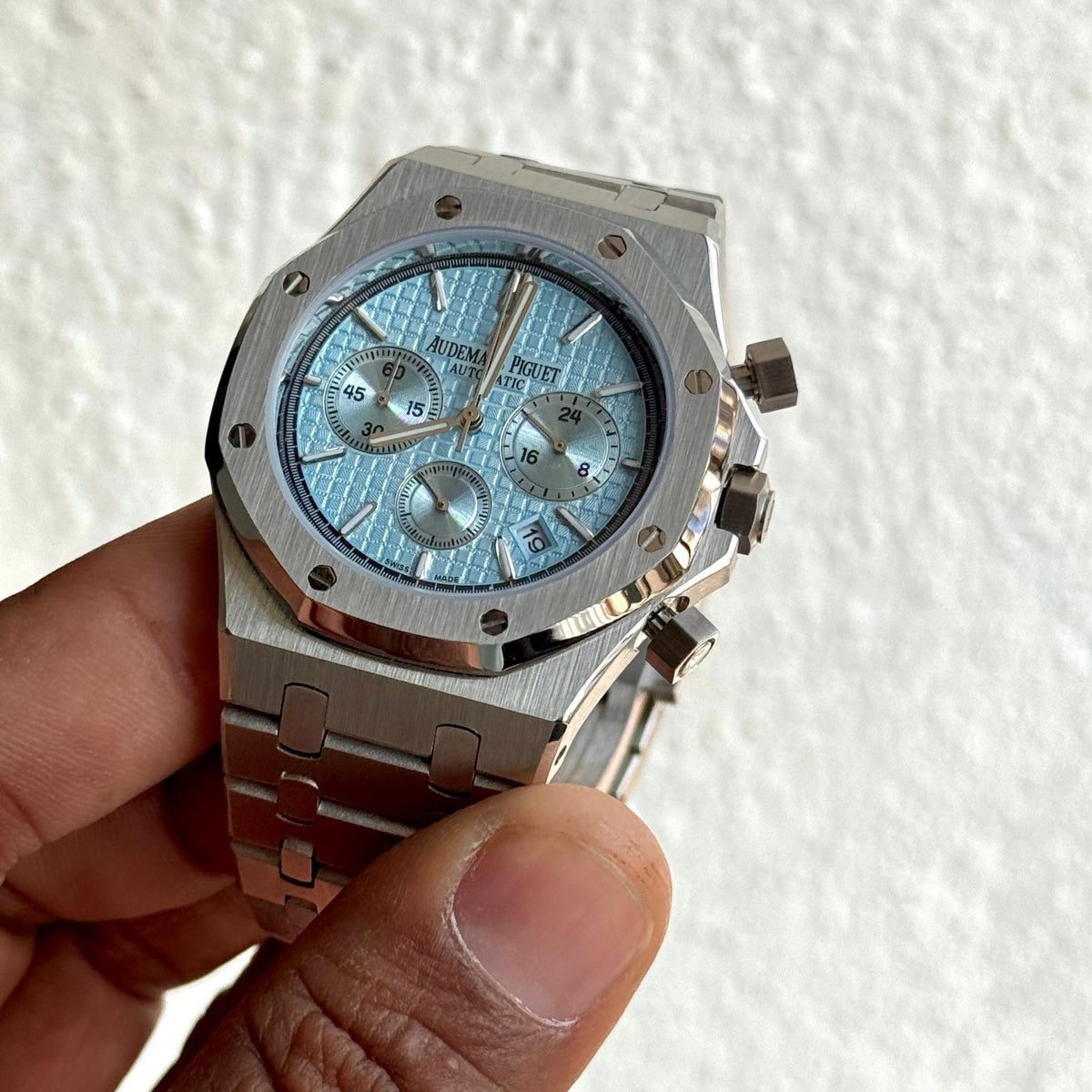 Audemars Piguet Royal Oak men's chronograph watch, light blue dial, silver stainless steel bracelet – in-hand close-up