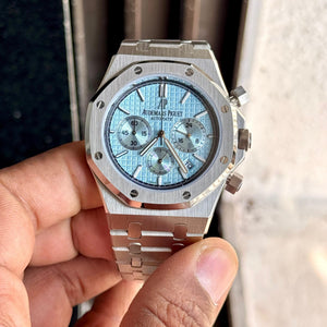 Audemars Piguet Royal Oak men's chronograph watch, light blue dial, silver stainless steel bracelet – in-hand front view