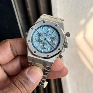 Audemars Piguet Royal Oak men's chronograph watch, light blue dial, silver stainless steel bracelet – in-hand view
