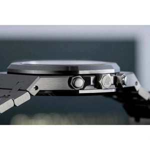 Audemars Piguet Royal Oak men's chronograph watch, orange dial, silver stainless steel bracelet – crown side close-up