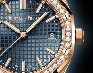 Audemars Piguet Royal Oak women's quartz watch, blue dial, diamond bezel, rose gold bracelet – dial close-up on dark background