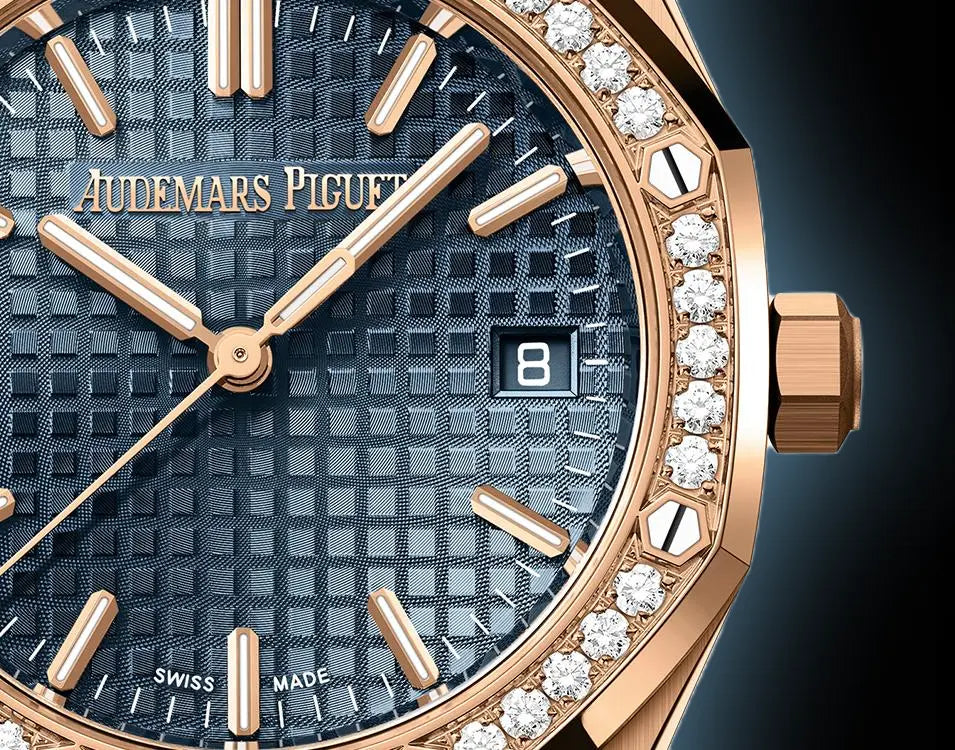Audemars Piguet Royal Oak women's quartz watch, blue dial, diamond bezel, rose gold bracelet – dial close-up on dark background