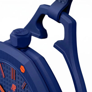 Close-up of a blue watch with orange accents on a white background