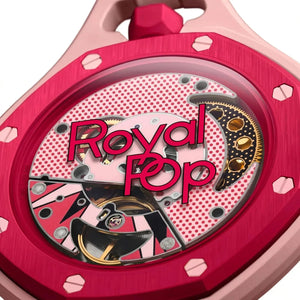 Close-up of a watch with 'Royal Pop' branding on a pink and red background