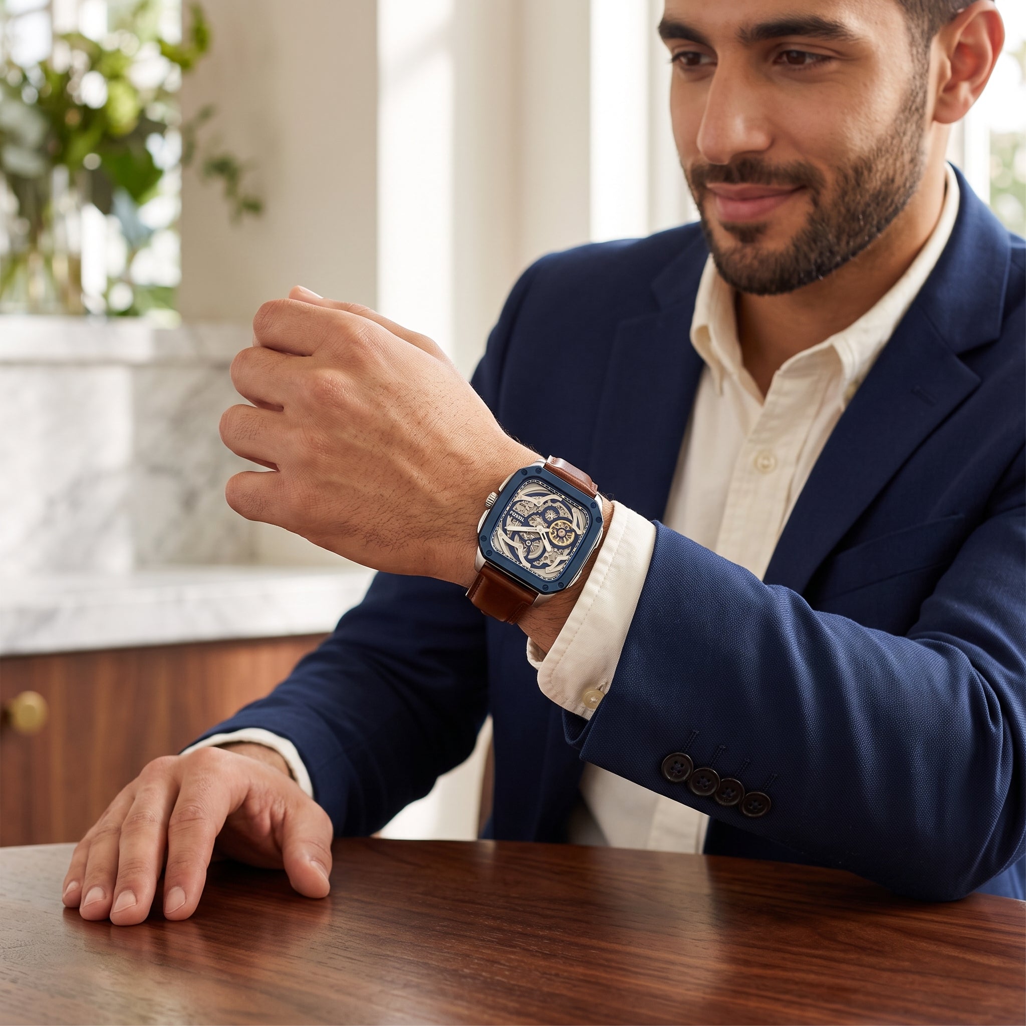 Luxury lifestyle image featuring the Fossil BQ2571 automatic skeleton watch.