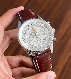 Breitling Navitimer 46mm men's chronograph watch, 46mm stainless steel case, white dial, brown leather strap – hand-held view