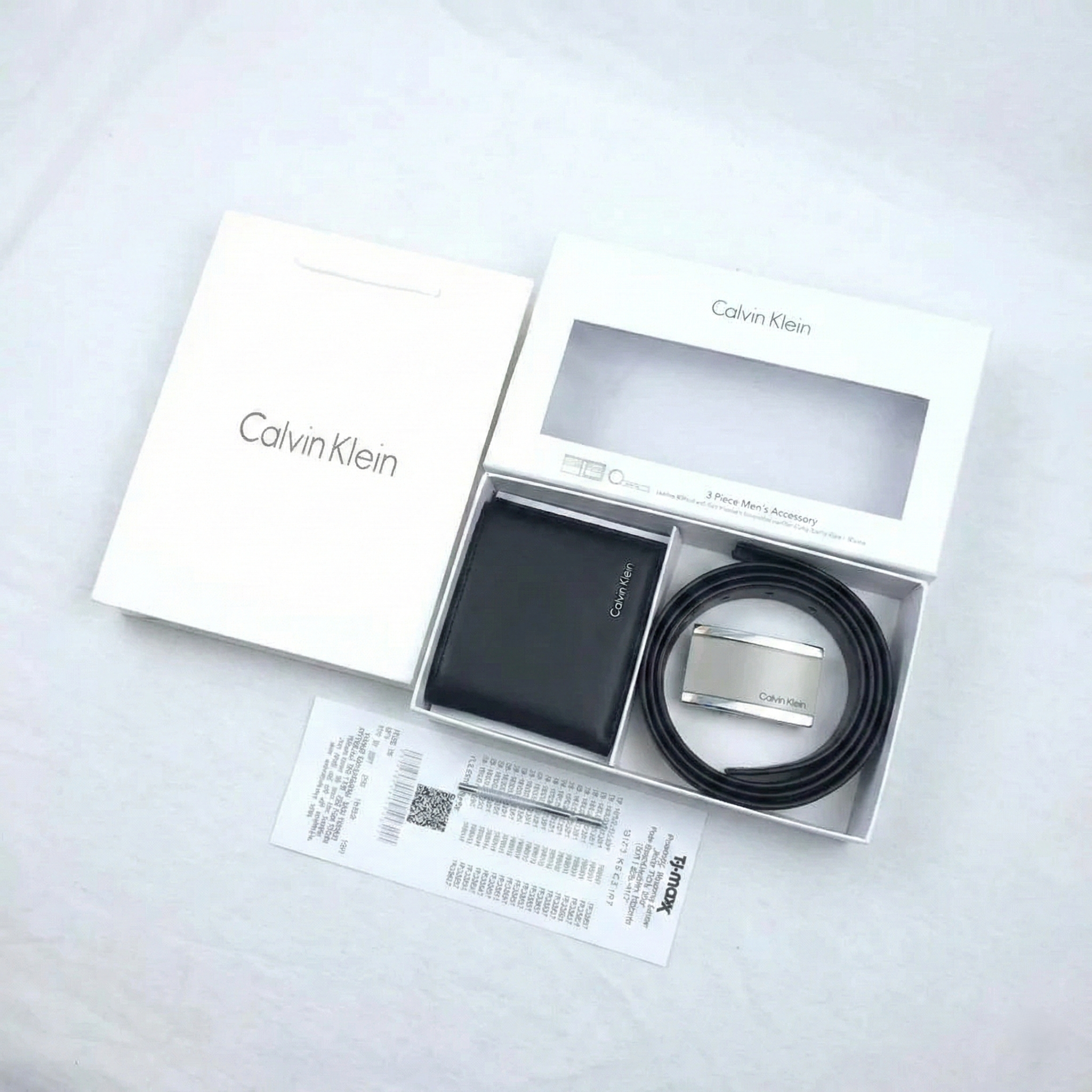 Calvin Klein wallet and belt set in packaging on a light gray background