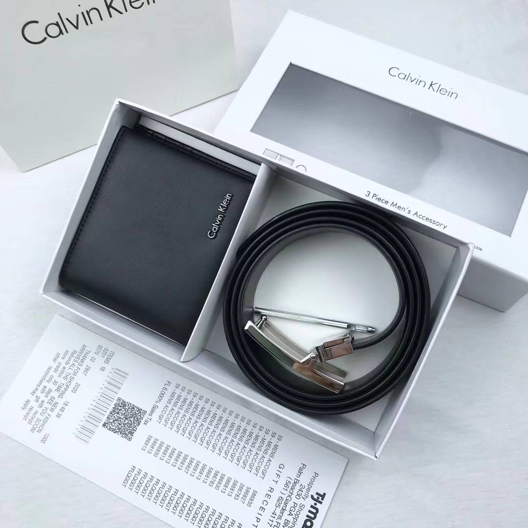 Calvin Klein wallet and belt set in a box on a white background