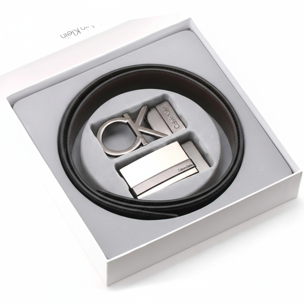 Calvin Klein men's belt gift set beautifully presented inside its original white branded luxury gift box, featuring the reversible strap and two interchangeable buckles