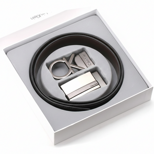 Calvin Klein men's belt gift set beautifully presented inside its original white branded luxury gift box, featuring the reversible strap and two interchangeable buckles