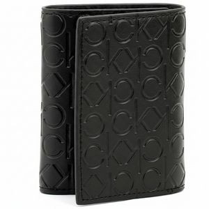 Perspective view of a standing Calvin Klein men's black leather wallet showcasing the front flap closure and the distinct all-over embossed CK logo pattern