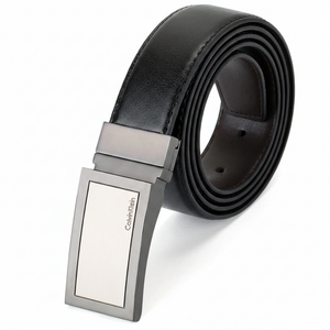 Black belt with silver Calvin Klein buckle on a white background
