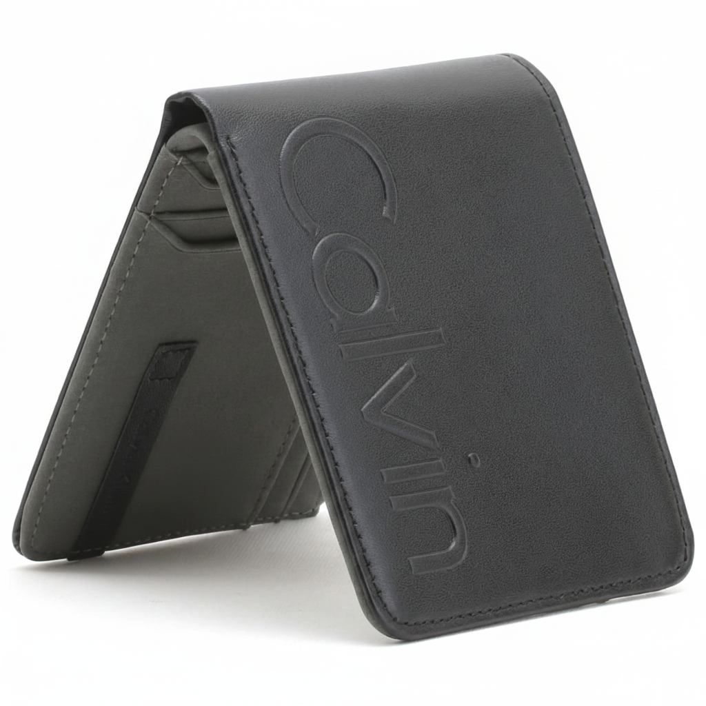 Angled front view of a closed Calvin Klein men's black leather wallet featuring a large debossed Calvin logo on the cover