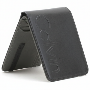 Angled front view of a closed Calvin Klein men's black leather wallet featuring a large debossed Calvin logo on the cover