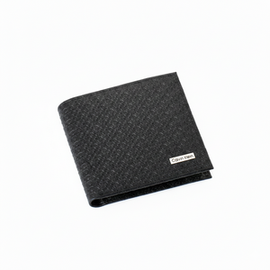 Perspective view of a standing Calvin Klein men's black leather wallet showcasing the all-over embossed CK monogram pattern and a silver metal logo plaque